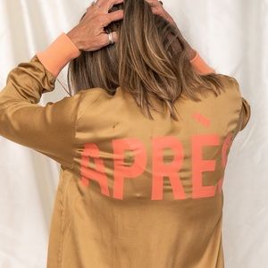 Angel wings gold jacket with coral APRES on the back rib sleeve detail